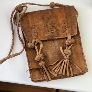 Vintage Handcrafted Leather Tassel Pouch Crossbody – West African Artisan Bag